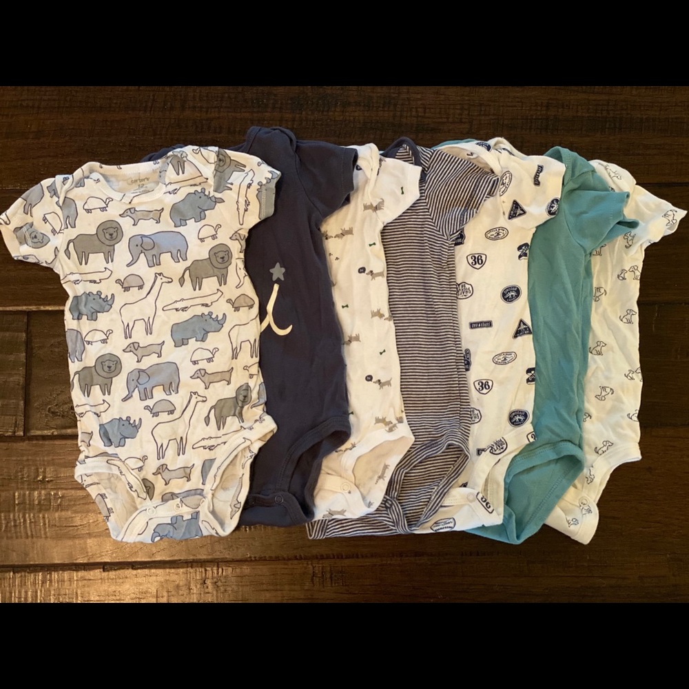 Short sleeve set of seven cotton onesies.